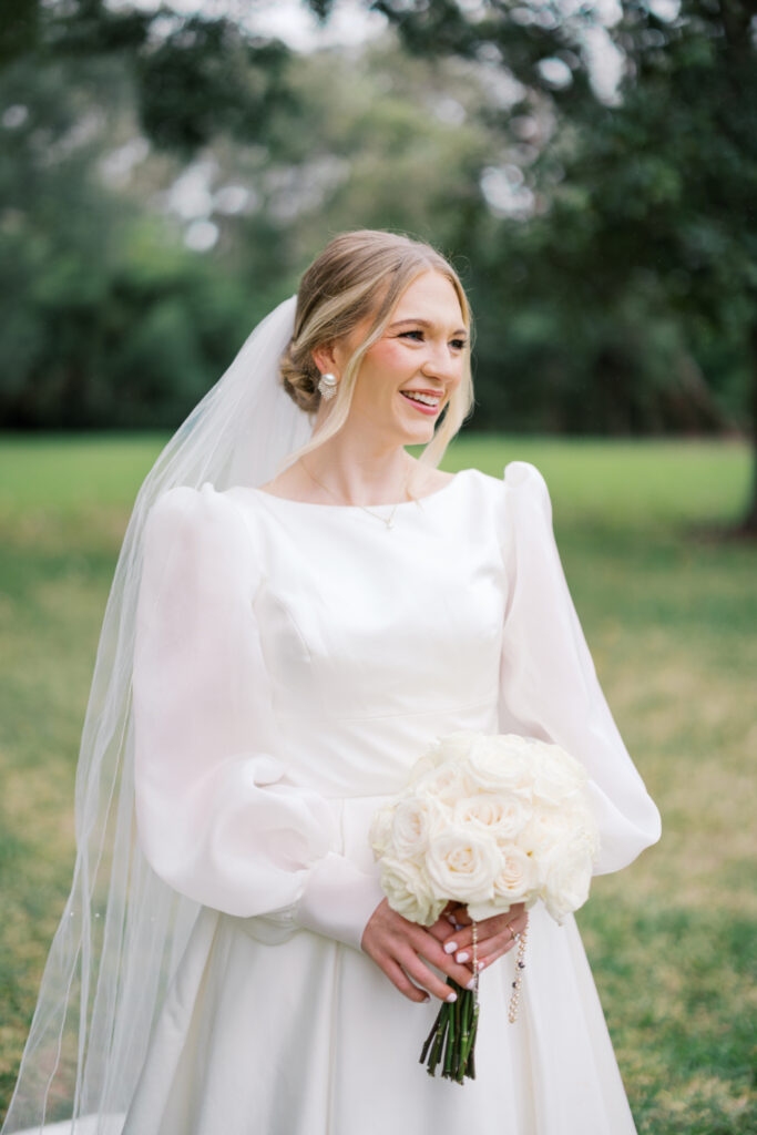 Bridal portrait photo with a veil and a white rose bouquet at Arlington Mansion taken by Morgan Alysse Photography