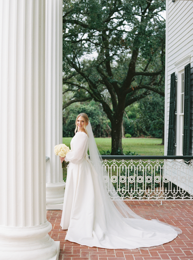 Bridal portrait photo with a veil and a white rose bouquet at Arlington Mansion taken by Morgan Alysse Photography