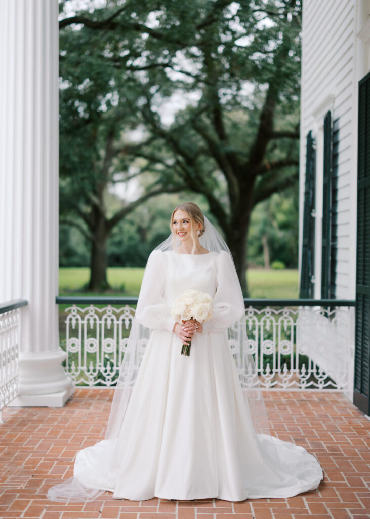 Bridal portrait photo with a veil and a white rose bouquet at Arlington Mansion taken by Morgan Alysse Photography