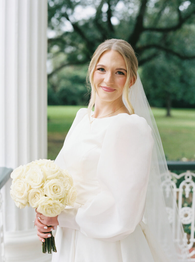 Bridal portrait photo with a veil and a white rose bouquet at Arlington Mansion taken by Morgan Alysse Photography