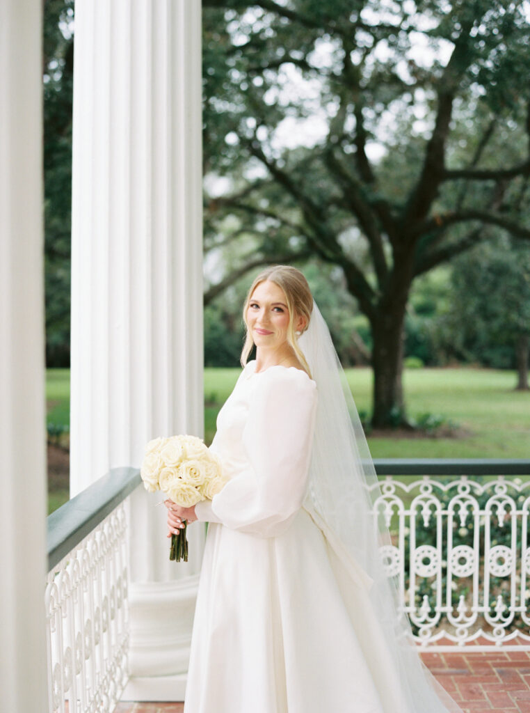 Bridal portrait photo with a veil and a white rose bouquet at Arlington Mansion taken by Morgan Alysse Photography