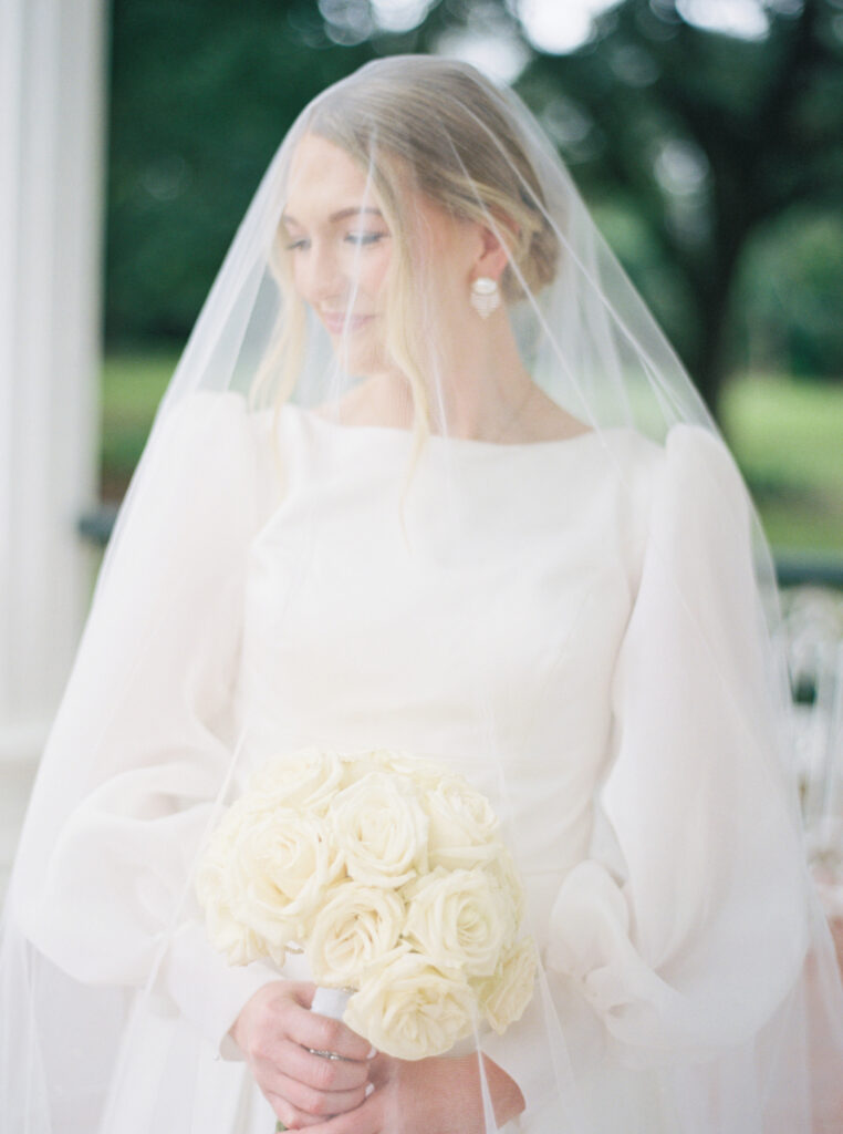 Bridal portrait photo with a veil and a white rose bouquet at Arlington Mansion taken by Morgan Alysse Photography