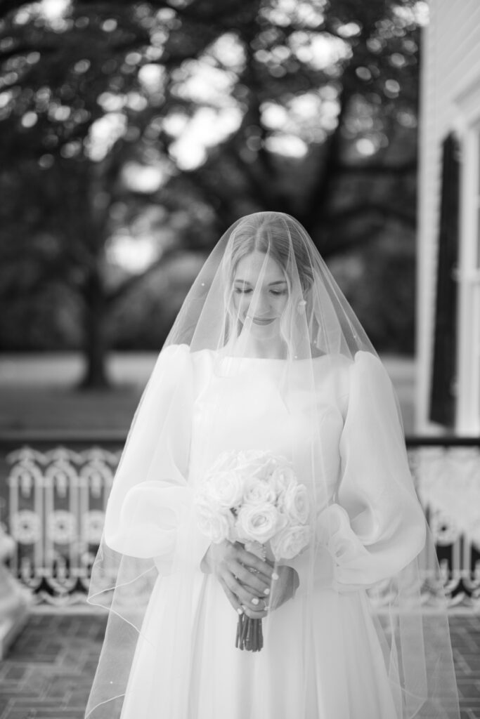 Bridal portrait photo with a veil and a white rose bouquet at Arlington Mansion taken by Morgan Alysse Photography