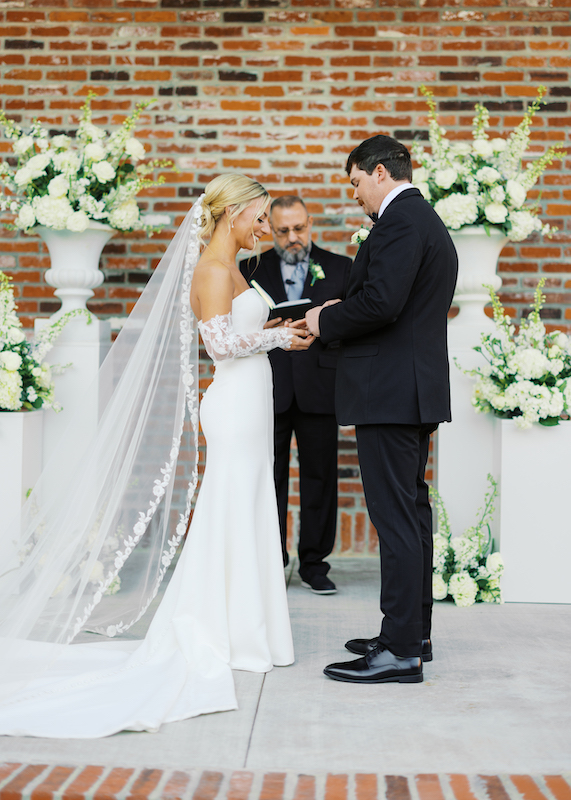 utdoor ceremony setup at Bayou Rum Distillery with floral columns