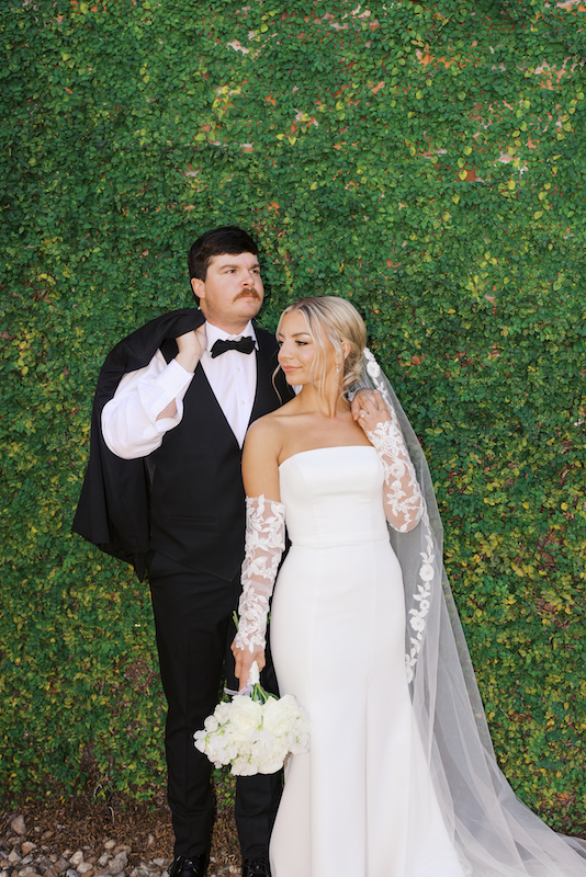 Bride and groom exchanging vows under the Louisiana sun at Bayou Rum Distillery