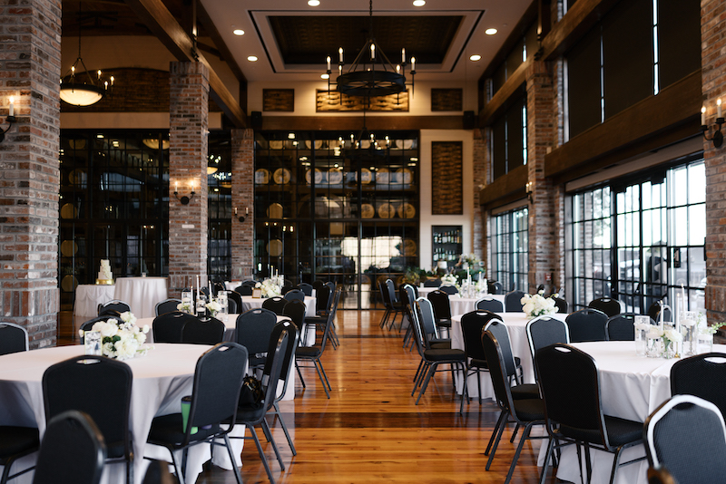 Elegant reception setup inside the barrel vault at Bayou Rum Distillery