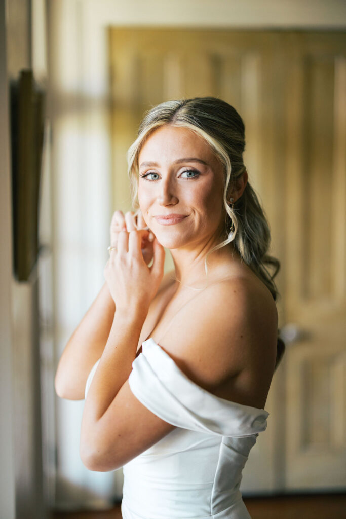 Bride’s elegant strapless gown with beaded details at Maison de Tours