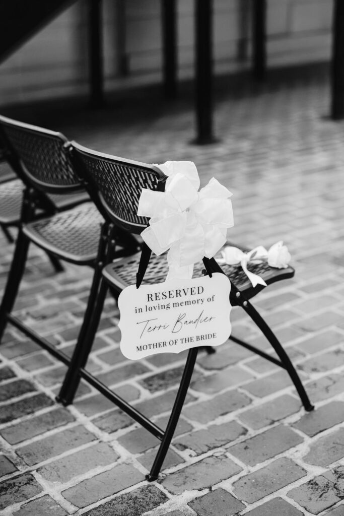 A reserved chair honoring the bride’s mother during the ceremony