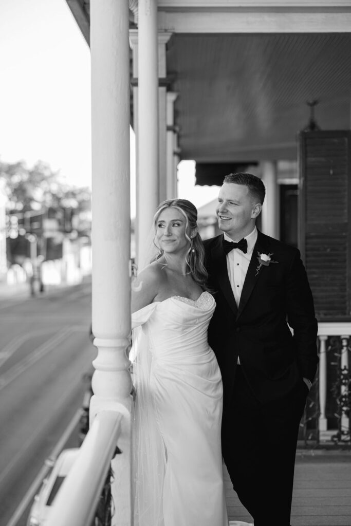 Romantic balcony portrait of bride and groom at Maison de Tours