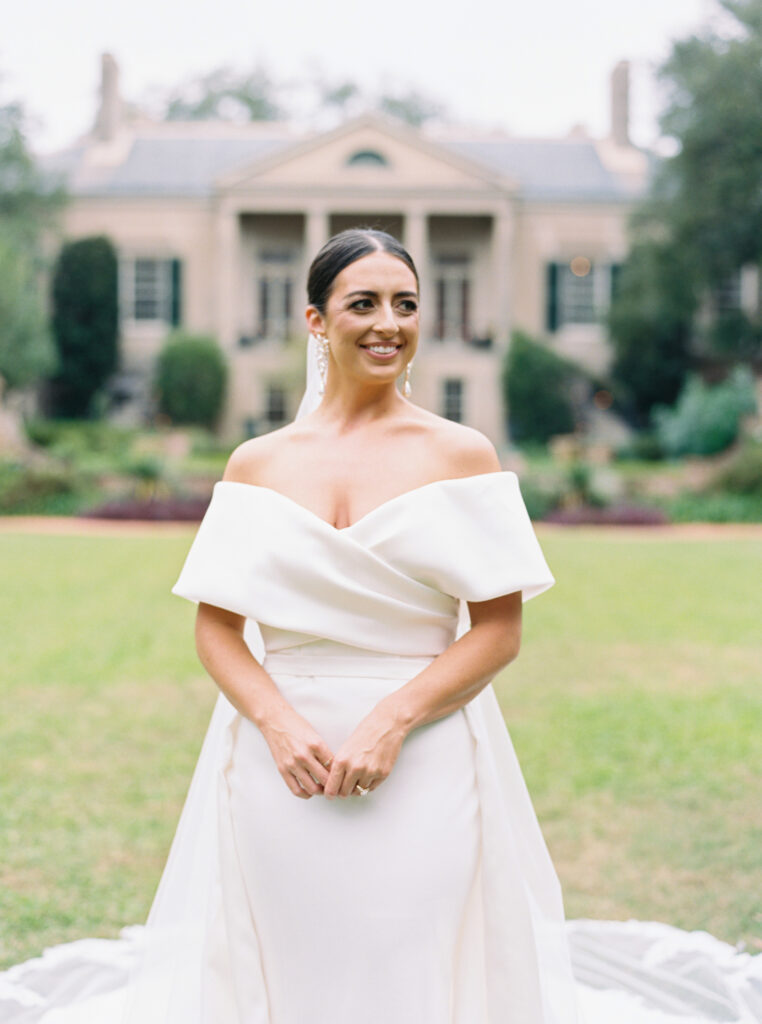 Classic Southern bride posing on the manicured lawns 