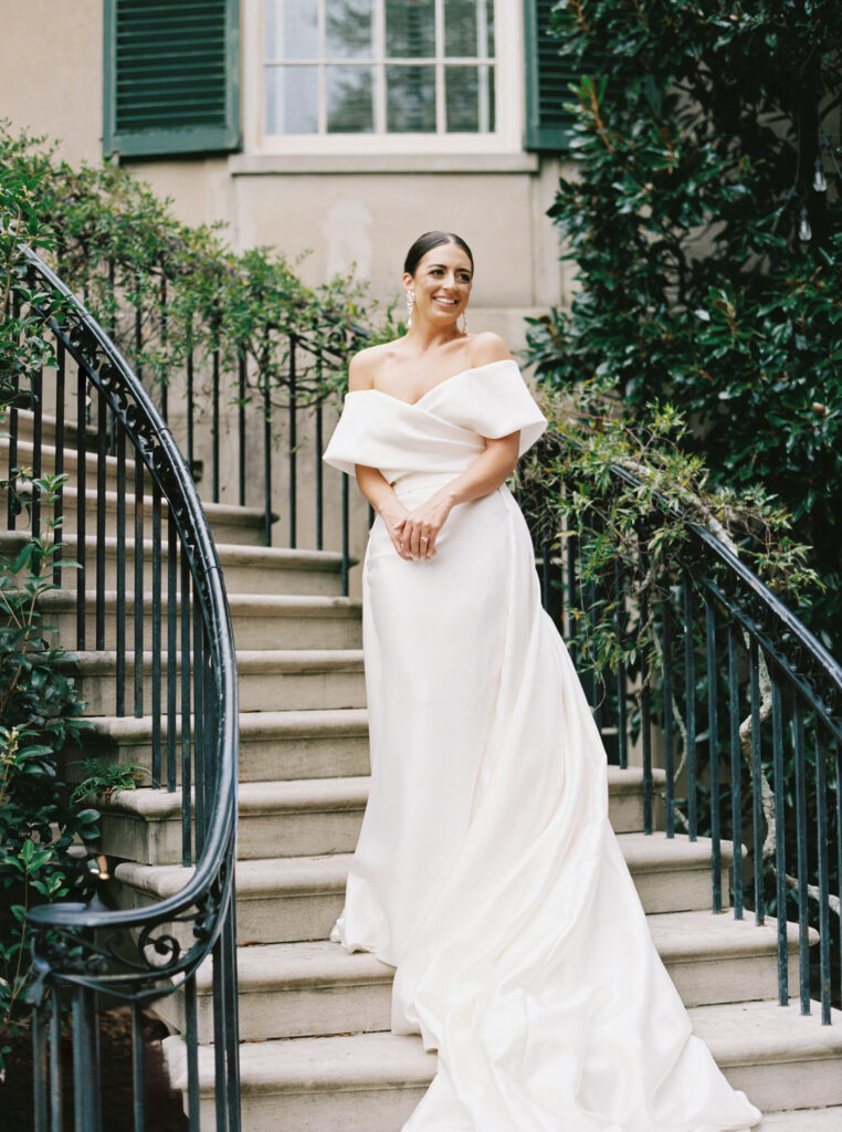 Bride standing on the columned porch