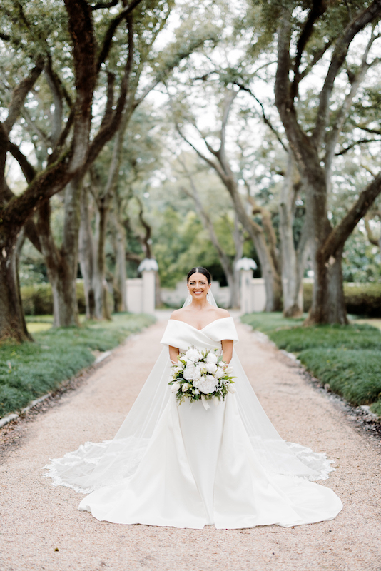 Longue Vue House and Gardens wedding venue featuring a beautiful bride in a veil.