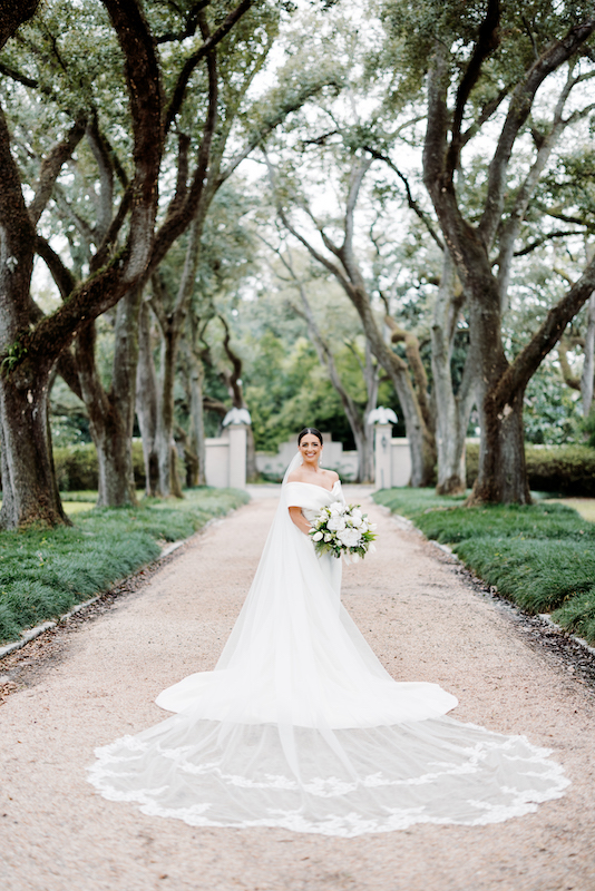 Close-up of a bride’s wedding gown at Longue Vue House and Gardens.