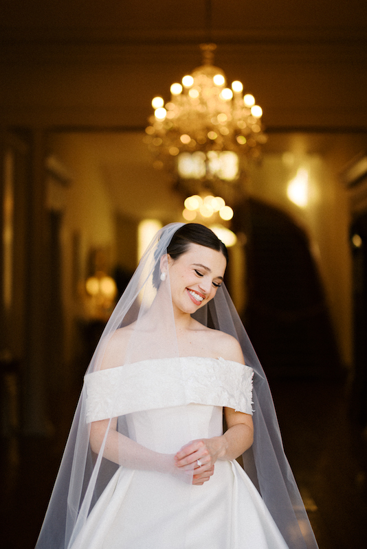 A breathtaking pondside bridal portrait with the plantation reflected in the water.