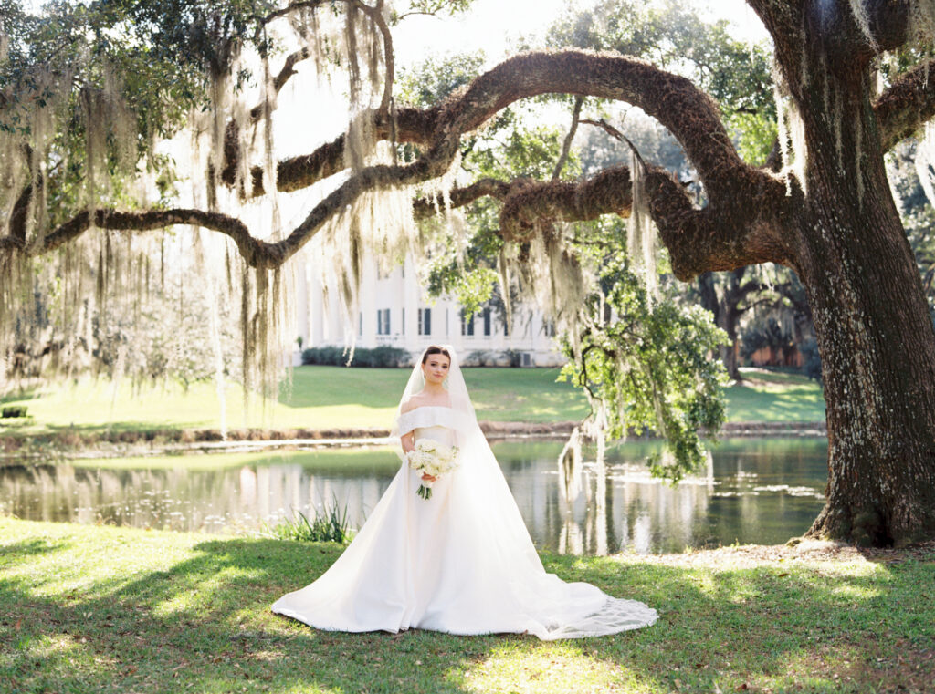 Bridal portraits at Greenwood Plantation featuring a bride in a classic satin ball gown.